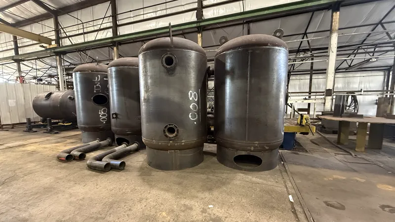 Row of vertical ASME Code pressure vessels in the Ramco shop