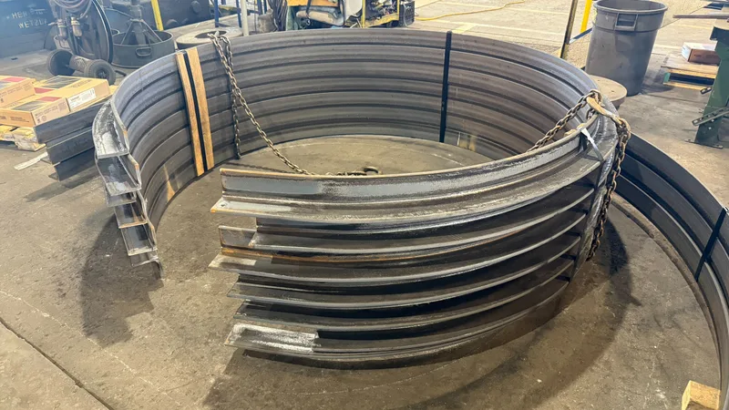 Angle rings rolled leg-out, stacked on the shop floor