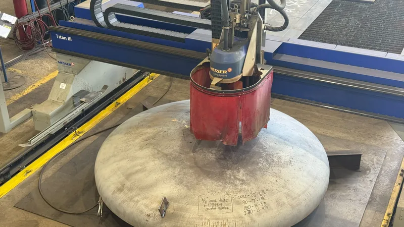 Flanged and dished head for a hyperbaric chamber on the CNC burn table, having its doorway cut